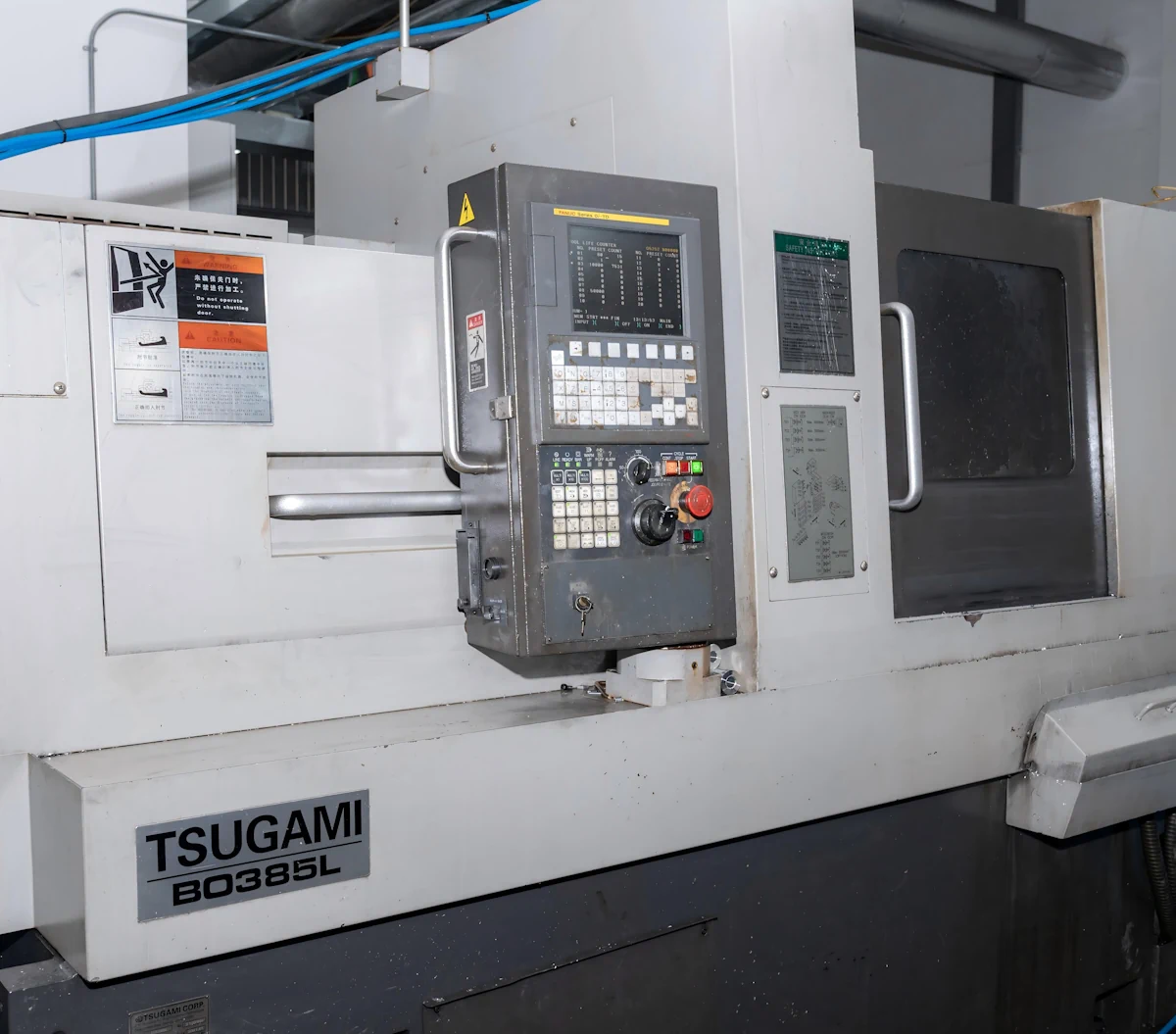Tsugami Swiss-type lathe on the production floor for precision turning operations